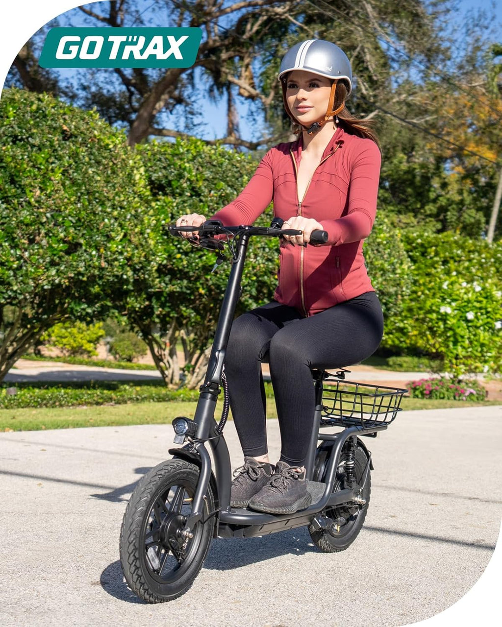 Gotrax adult electric scooter with seat, maximum range of 19-25 miles, all-terrain tires, wide pedals, padded seat, and carrycot